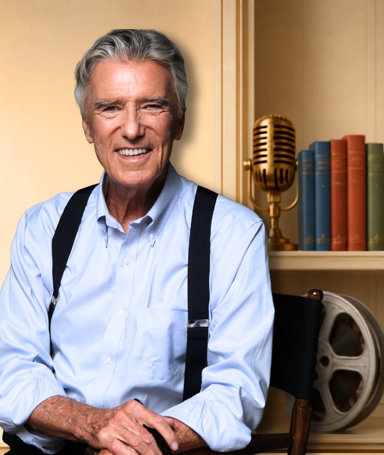 Bill Walton seated in his study, beside a vintage microphone and shelves of books.